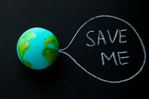 Homemade model of the Earth planet on a chalkboard with the inscription save  Stock Photos