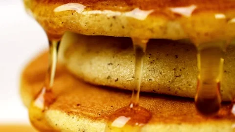 Homemade Pancake for easy breakfast. Maple syrup being poured over pancakes. Video stock 336589018