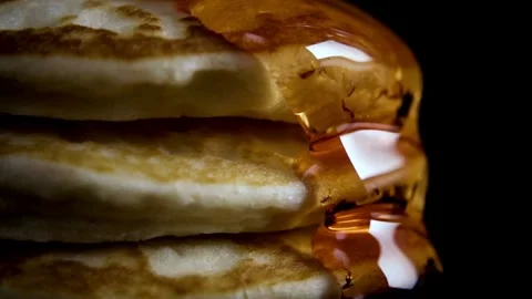 Homemade Pancake for easy breakfast. Maple syrup being poured over pancakes. Stock-Footage 336589122