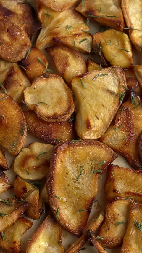 Homemade parsnip chips background texture. Vertical video. Stock Footage 294245400