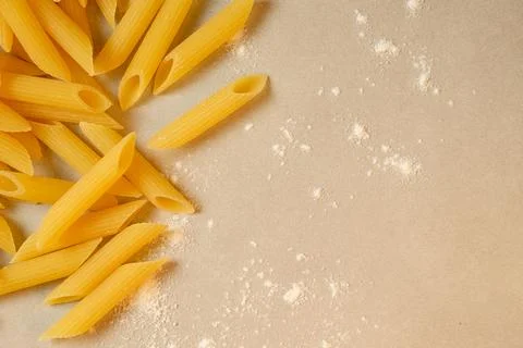 Homemade pasta preparation on a kitchen counter with flour scattered Stock Photos
