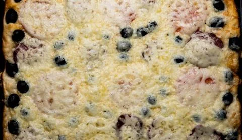 Homemade pizza with cheese tomatoes ham Stock Photos