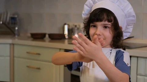 Homemade pizza, process of cooking, boy shaking off flour from his hands Stock Footage 125561859