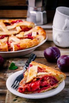Homemade plum pie on rustic background Stock Photos