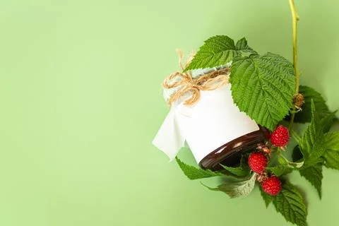 Homemade raspberry jam jar with blank label and fresh berries Stock Photos