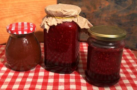 Homemade raspberry jam jars in modern kitchen Stock Photos