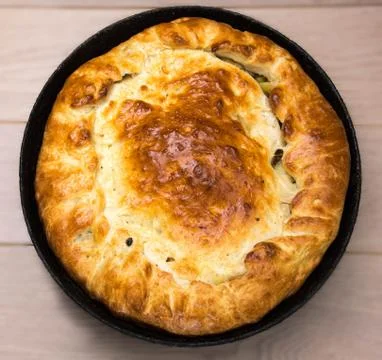Homemade round cake on wooden table background Stock Photos