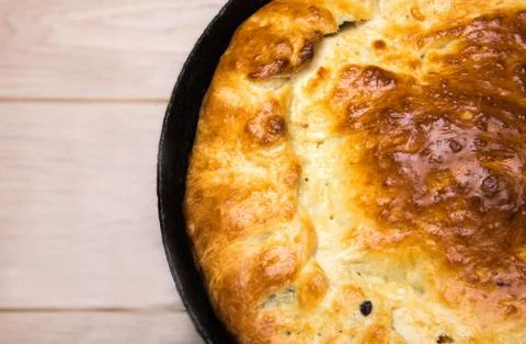 Homemade round cake on wooden table background Stock Photos