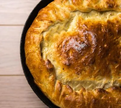 Homemade round cake on wooden table background Stock Photos
