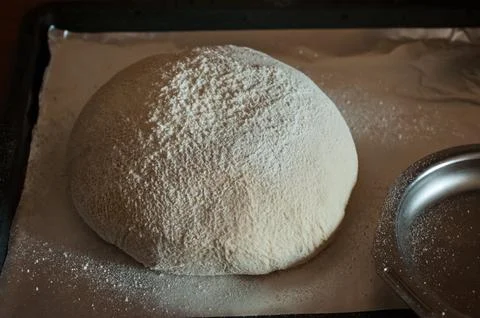 Homemade rustic bread, artisan baking process, close-up of fermented dough, f Stock Photos