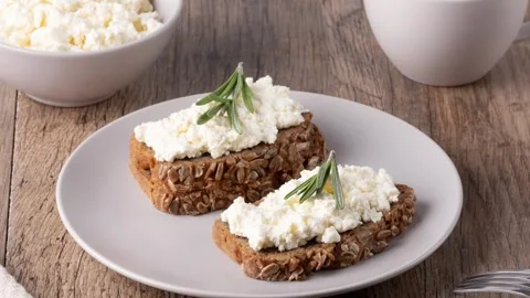 Homemade rye bread with cottage cheese in a plate and coffee Stock Footage 345360314