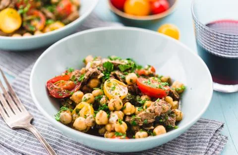 Homemade  salad with chickpea, roast beef and cherry tomatoes with red wine o Stock Photos
