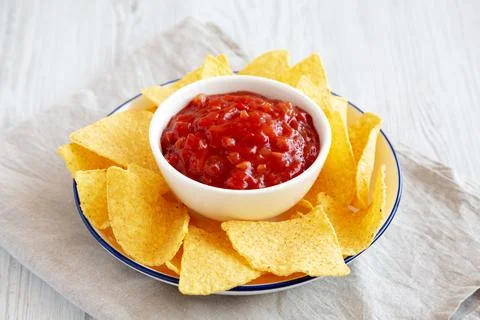 Homemade Salsa and Tortilla Chips on a Plate, side view. Stock Photos