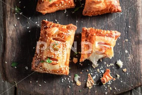 Homemade sausage in puff pastry as a snack for breakfast Stock Photos
