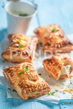 Homemade sausage in puff pastry with tatar sauce and herbs Stock Photos