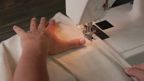Homemade sewing project preparing folded linen fabric for stitching Stock Footage 345456558