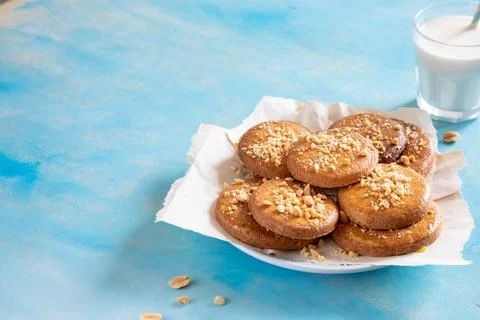 Homemade shortbread cookies with peanuts on a trendy blue background. peanu.. Stock Photos