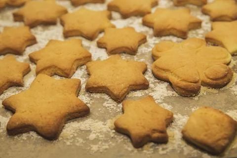 Homemade shortbread in the shape of star on baking sheet Stock Photos