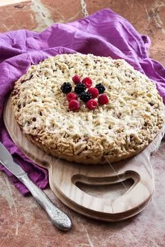 Homemade shortcrust berry pie with crumble on wooden board Stock Photos