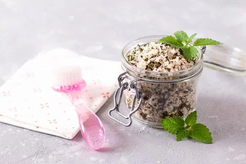 Homemade sugar scrub with chopped mint leaves and body brush. Natural beauty Stock Photos
