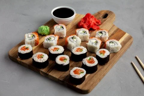 Homemade Sushi Platter with Wasabi and Soy Sauce on a Board, side view. Stock Photos