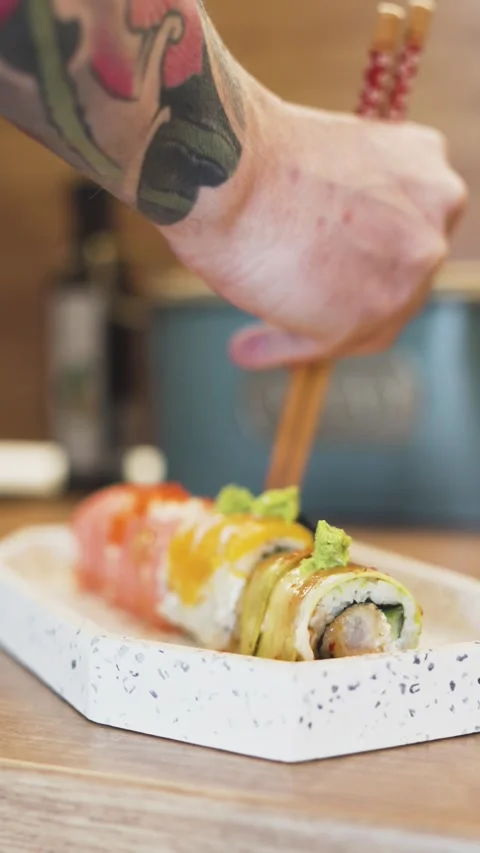 Homemade Sushi Roll Gets Final Ginger Topping by Hand in a Warm and Inviting Stock Footage 306673337