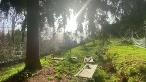 Homemade swing set in an ugly and unkept park Stock Footage 236170506