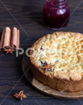 Homemade tasty shortcrust pie with fruit or jam, crumble and spices. Stock Photos