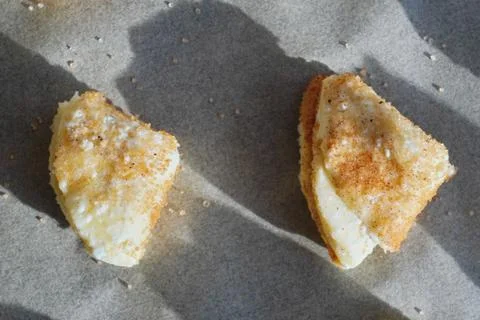 Homemade triangular-shaped cottage cheese cookies with sugar and cinnamon. co Stock Photos