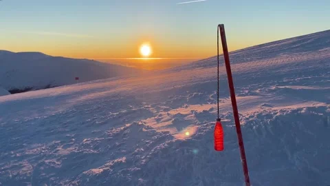 Homemade wind indicator at the top of the mountain. Bottle on a rope. Video stock 148434966