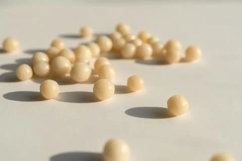 Homeopathic balls on the surface. Stock Photos