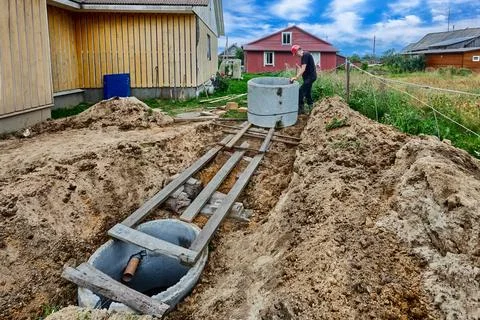 Homeowner created roller bed system from scrap materials to install concret.. Stock Photos