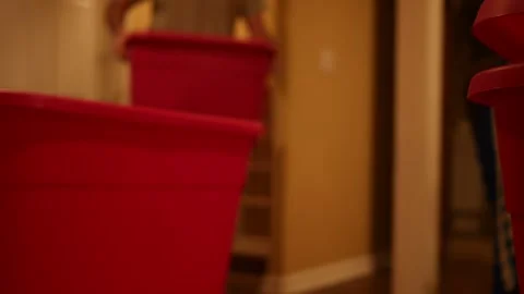 Homeowner places Tote on Stack during Home Move Stock Footage 324684882