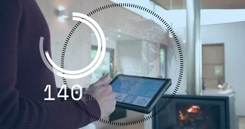 Homeowner tapping tablet screen and adjusting smart home stock limit with 스톡 동영상 320088444