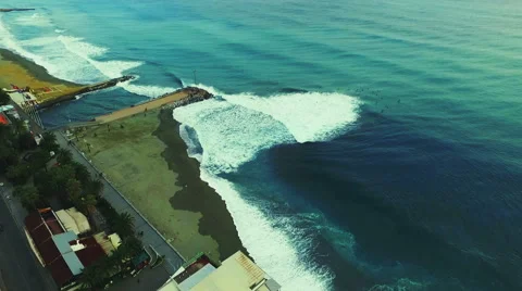 Homes along the beach and waves. Aerial drone video.N Stock Footage 63823269