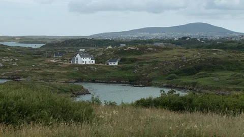 Homes At Base Of Mountainous Bluff Stock Footage 115837962