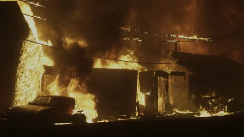 Homes in flames, Firestorm burning in the Pacific Palisades of Los Angeles Stock Footage 299787274