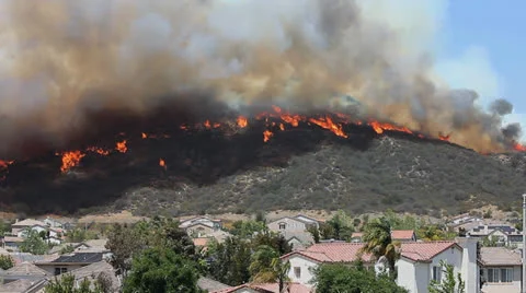HOMES IN PATH OF BRUSH FIRE Stock Footage