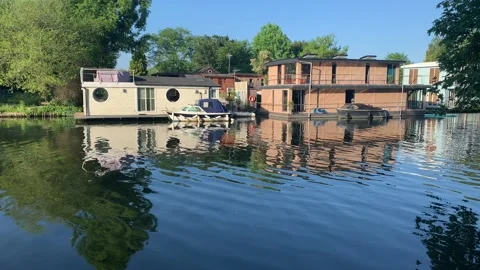 Homes reflected in the river thames at Hampton Stock Footage 156025263