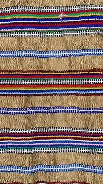 Homespun carpets made with colorful patterns woven on traditional looms in .. Stock Photos