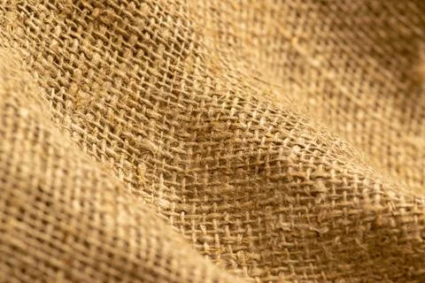 Homespun fabric with a rough texture surface pattern. Close up. Stock Photos