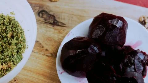 Homestyle cooking process view: combining beetroot with herbs and spices Stock Photos