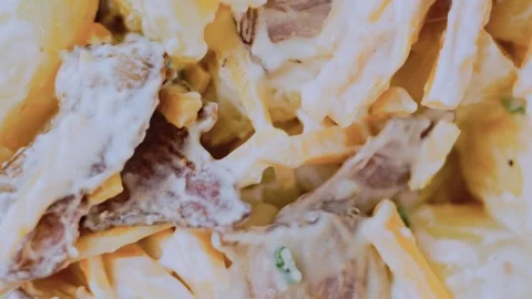 Homestyle fine dining angle: arranging the loaded potato salad Stock Footage 342198892