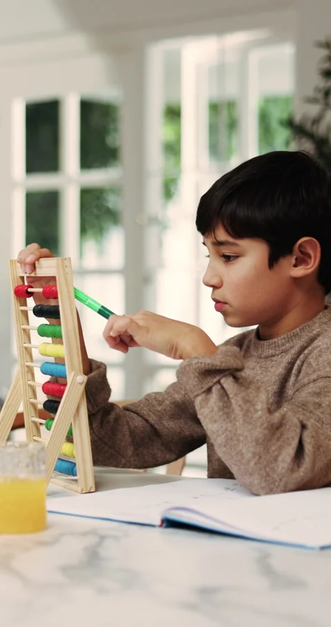 Homework, child and counting on abacus in home for mental math, problem solving Stockbeeldmateriaal 338161393