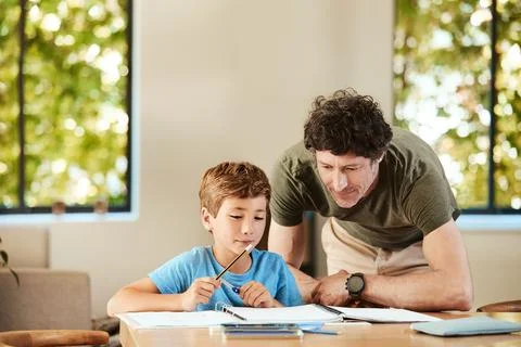 Homework, help and dad with child for learning, assignment and teaching ski.. Photos
