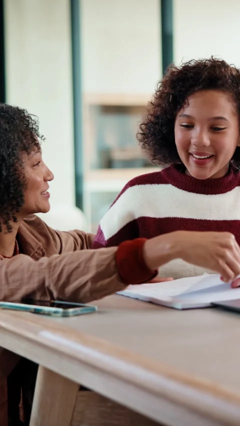 Homework, high five and mom with girl in home for online lesson, elearning and Stock Footage 335786861