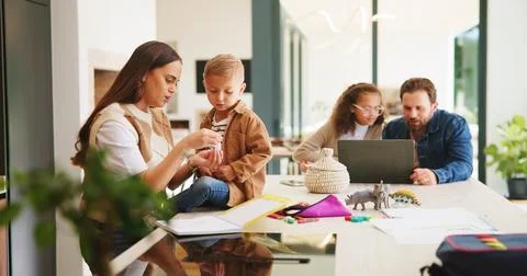 Homework, support or children at table with parents, help or knowledge in Stock Photos