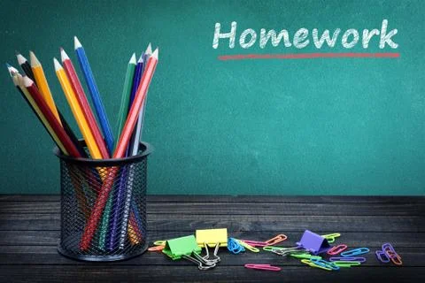 Homework text on green board Stock Photos