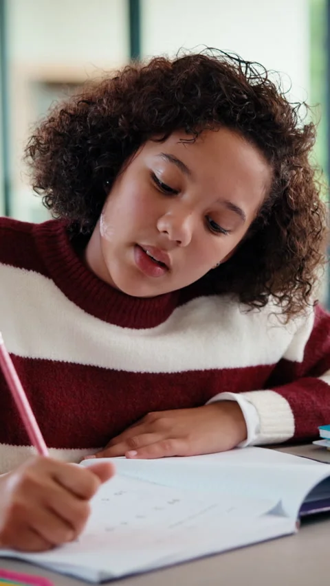 Homework, thinking and child writing in home for activity sheet, education and Stock Footage 335887493