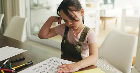 Homework, thinking and study with child in home for learning, education and.. 写真素材
